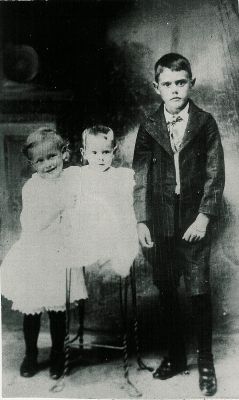 These children are Luna, Ruby and Glen Russell, children of Steve and Josie Russell of Flat Ridge, taken about 1917. Ruby and Glen were later infected with polio. Ruby survived with paralysis, but Glen did not survive.

