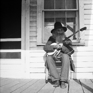 Monroe Caudill playing banjo
James Monroe Caudill-born 28 April 1877-died 26feb 1957 to Cynthia Ann Caudill. His father was Richard "Dick" Sidden of Wilkes County who later (Monroe was in his twenties) married Cynthia. Monroe married Myrtle Jane Rector the daughter of Abe and Martha Brackins, Rector. Ther had three children, Emma , Carpenter, Mary Ann Todd and Johnny Caudill who married my aunt Rose Emma Medley. Monroe would sit on the porch of his house at "Teapot Dome" Alleghany County, NC and play his banjo for passers by.  Courtesy
