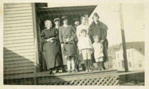 Galax - Harris Hotel
Granny Harris, Onnie Allred, Nettie [Allred] Marshall and Lee, Grace Harris, Mrs. Saunders Moore, E.M. Davis, John B and Jake
 
Also, written there is this note: "Harris Hotel, Galax Virginia--1917"
 
Also this note: "Building in background Luke Biships Livery Stable."
 
This should be Lute Bishop I believe.
 
The photo is not the best quality. Still, I thought it might be of interest to you. Nettie was the daughter of Thomas C. Allred and Julina Frost. Thomas was the son of Suttle, also written Settle, Allred whose wife was Eliza Belton. Suttle was the son of Jesse Allred of Randolph County, NC whose wife was Alcey York.
 
Julina Frost was the daughter of Stephen F. Frost a Civil war veteran from Carroll. I have a short note about him below. Stephen descends from the Revolutionary War soldier John Frost who is buried in the Frost cemetery in Carroll. I have a photograph of Stephen F. Frost, but it needs to be restored.
 
Courtesy of  Mike Marshall Summerfield, NC [email]mmarshall13@triad.rr.com[/email]
 

