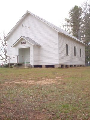 South Fork Regular Baptist Church, Piney Creek
This congregation was organized in 1840.  The church divided in the 1860s over the Civil War, with the other faction styling itself Primitive Baptist.  The Primitive Baptist faction had a meeting house on the Ashe County side of the South Fork.  This congregation closed about 1960, and that meeting house has gone to ruin.  This meeting house photo was taken April 16, 2006 by Jeff Weaver.
