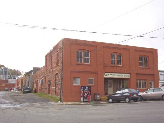 100_1787.jpg
This photo shows the offices and shop for Ashe County Cheese, North Carolina's only cheese factory.  It was established on Helton Creek about 1915, and then bought by Kraft Foods in 1929 and moved to West Jefferson.  When Kraft proposed to close it, the local employees bought it and continue to operate it.  Photo by Jeff Weaver, October 20, 2006.
