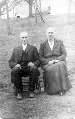 Hash, Boyden and Tamsey Rutherford
This photo is of Boyden & Tamsey (Rutherford) Hash in their old age down at Gold Hill, VA.  You can see the covered wagon faintly in the back on the top of the hill.  From the Howard Hash Collection, courtesy of Brenda Hash Eugenio [email]cherokee9550@verizon.net[/email]

