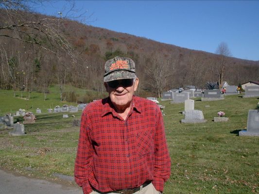 EarlBlevins.jpg
This very nice gentleman stopped what he was doing to show us where the Kell cemetery was.  Earl was blowing leaves off the parking lot of a community center across from the church. He (I think-I didn't write a thing down) is a descendant of Squire & Sarah Ann. He led us to the cemetery, went home & came back to make sure we got back down the hill alright. He gave me his phone # and called his cousin Daniel Smith Blevins in Marion about Rhoda. Anyway he was very helpful, friendly & nice. [email]Courtesy of Nanalee Wrenn[/email]

