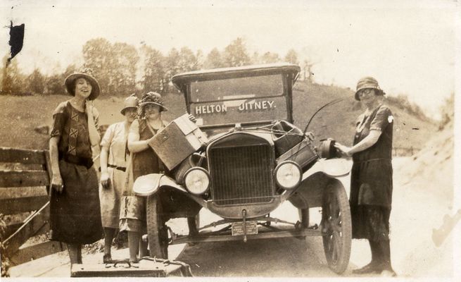 Helton Jitney
This one was in my aunt Lola Kilby Sewell's photo album. She moved to Harford County, MD, with her family (Roby and Eva Kilby family) in 1915 but returned to the mountains in the early 1920s to get her teaching degree from Boone. This photo caught my eye because this apparently was a mode of public transportation, presumably from Helton to Boone. I don't know that there was a "bus" from Harford County to Helton at that point. Later there was bus service from Bel Air to Sparta, I believe. She must have taken the train from Harford County to Boone. If you have any knowledge of this jitney, I'd like to know the facts. That's could be Aunt Lola on the left but I'm not positive.  Courtesy of Emily Kilby [email]erk44@verizon.net[/email]

