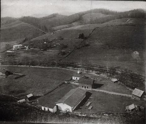 Littlewoodproperty1900a.jpg
This picture was probably taken between 1900 and 1905. The mill, built around the turn of the century to replace the burned mill belonging to the Perkins family, was bought by John Littlewood, an immigrant from 
Yorkshire, England. In about 1900 his son Herbert Littlewood joined his  father in the business. The mill is the long building at the center  bottom. The two story building facing it was a general store. The two 
cottages were the Littlewoods' residences. The Victorian house upper left was the Perkins's home.
Courtesy of Emily Kilby [email]erk44@verizon.net[/email]

