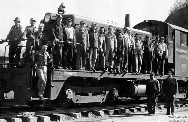 Saltville - Mathieson Alkali Works Train Crew 1947
TRAIN CREW  /   MATHIESON ALKALI WORKS  /  SALTVILLE OPERATIONS  /  SALTVILLE, VA.  /  SHOWING THE NEW DIESEL LOCOMOTIVE  /  1947
 
 FROM LEFT - BILL  DAVIDSON,  WALTER  SWORD,  UNKNOWN - A GENERAL MOTORS FACTORY REP,  JOHN  LITTLE,  CHARLIE  CALL,  JOHN  LOUTHIAN, ESSIE  GREER,  GEORGE "PENNY" HAYNES,  ANDREW  FRYE,  JOHN  BORDERS,  LEO  FIELDS,  UNKNOWN - A GENERAL MOTORS FACTORY REP,  JOHN HENRY SHORTT,  EUGENE  CASSIDY,  RALPH  COMER,  ED  PATRICK, STANDING ON STEPS AT FRONT OF ENGINE - AUDREY  BILLINGS; STANDING ON GROUND - FROM  LEFT - ROME  NIPPER  AND  JOE  DAVIDSON
 
PHOTO  COURTESY  EDDIE  "NIM"  PATRICK.  Courtesy of Don Smith [email]dsmith1043@comcast.net[/email]


 
Keywords: Smyth County, Va, Train, Saltville, Mathieson Akali, Diesel, Locomotive