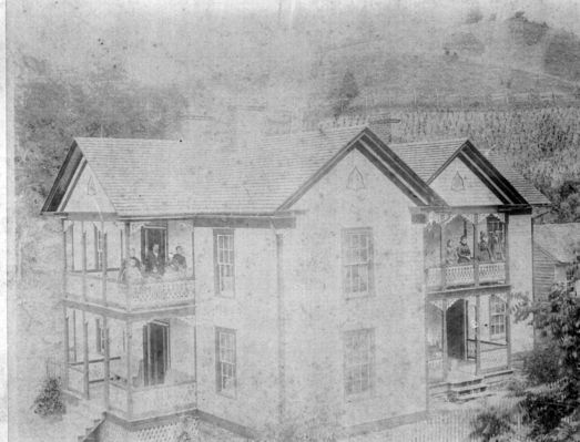 Pennington home & family
This picture was taken in1892/3 not long after completion of the house built by Cicero on what is now Spencer Branch Road. The older children standing on the  right balcony are Franklin, Victoria (Halsey), Martha Virginia (Weaver)  and Cora (Pugh). On the left balcony with parents are Callie (Weaver, Kilby), Stephen Glen, William Edward, Joanna (Wall) and Charles Bradley in front of Cicero Pennington and Carl in arms of Almeda Grubb Pennington. Youngest son Dent was born in 1895.  Courtesy of Emily Kilby [email]erk44@verizon.net[/email]

