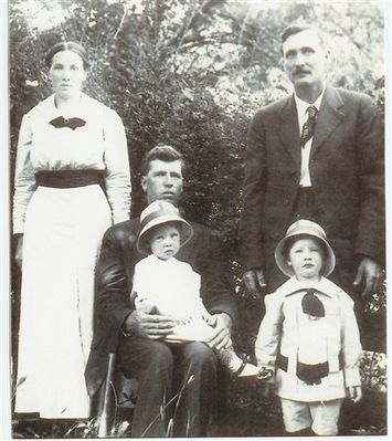 WadeJonesSr.andDentonYoung001.jpg
Standing Denton Young Jones and unknown man.  seated Wade Jones Jr. holding Gilmer and in front of him Wade Jones Jr.  Courtesy of Danny Miller [email]millerd@fuse.net[/email]

