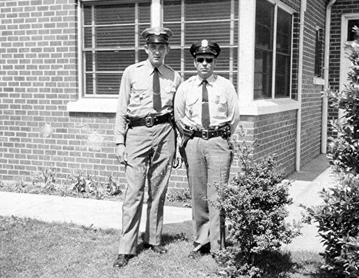Saltville - Police Department
KYLE ADAMS, LEFT AND CHARLIE NORRIS  /  SALTVILLE TOWN HALL  /  SALTVILLE, VA.  /  1950s.  Courtesy of Don Smith [email]dsmith1043@comcast.net[/email]

 
