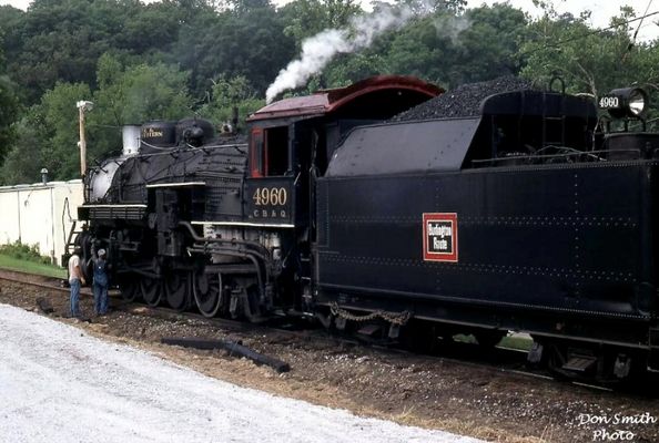 CB&Q Engine
CB&Q ENGINE 4960 WAS PUT INTO EXCURSION WORK IN 1958, RETIRED TO CIRCUS WORLD MUSEUM IN 1966 THEN DONATED TO THE MID-CONTINENT RAILWAY HISTORICAL SOCIETY MUSEUM IN NORTH FREEDOM, WISCONSIN.  IN 1980, 4960 WAS LEASED TO THE BRISTOL AND NORTH WESTERN RAILROAD.
 
BUILT IN AUGUST OF 1923 BY BALDWIN LOCOMOTIVE WORKS, CB&Q ENGINE 4960 HAD BEEN SPARED THE TORCH AND WAS DOING EXCURSION WORK FOR THE BRISTOL AND NORTH WESTERN RAILROAD FROM BRISTOL TO BENHAMS, VA. IN THE SUMMER OF 1981.  THE VENTURE PLAYED OUT AND IN 1985 4960 WAS MOVED TO FT. WAYNE, INDIANA. 
 
IT WAS PURCHASED BY THE GRAND CANYON RAILWAY SHORTLY THEREAFTER.  AFTER ONE OF THE MOST EXTENSIVE REBUILDING EVER DONE ON AN OLD STEAM LOCOMOTIVE, COSTING HUNDREDS OF THOUSANDS OF DOLLARS, ENGINE 4960 WAS PLACED IN SERVICE BY GRAND CANYON RAILWAY AND HAS BEEN DOING EXCURSION WORK SINCE THE MID 1990'S.  Courtesy of Don Smith [email]dsmith1043@comcast.net[/email]

