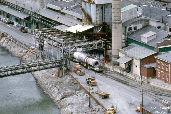 Saltville - Decommisining of Olin May 1972
THESE ROTARY DRIERS ROTATED AND DRYED THE SODA ASH AND MOST OF THE TIME THERE WAS A SNOWSTORM OF ASH COMING FROM AROUND IT FILLING THE FLOOR UNDERNEATH. THE ASH THAT LEAKED OUT WOULD BE SHOVELED UP AND ROLLED BY WHEELBARROW TO THE DIRTY ASH POT, COOKED AND SENT TO THE CAUSTIC SHED. 
 
THERE WAS NOTHING QUITE LIKE THE DRY SIDE OF OLIN'S AMMONIA SODA DEPARTMENT.  Courtesy of Don Smith [email]dsmith1043@comcast.net[/email]

 
