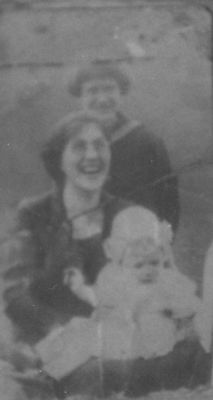 emalineweaver.jpg
This is Emaline Sturgill Weaver, holding daughter Mary in 1923.  Guida Sturgill (later married to Worth Weaver) is standing in the back.
