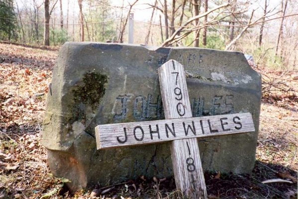 "Snakebite" John Wiles
Headstone of "Snakebite" John Wiles (1790-1815).  He was buried in the Holloway Cemetery, located deep in the woods on Wiles Ridge, near Traphill.  Picture taken in 2000.  Courtesy of Jason Duncan [email]jmduncan@statesville.net[/email]

