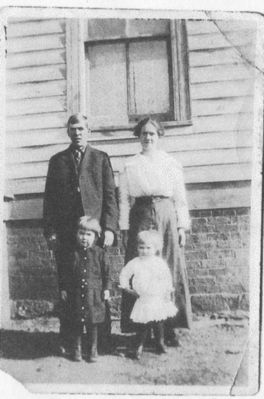 jonesrobertja.jpg
Robert Joshua Jones (B. 1888 son of Charlie and Lear Rutherford Jones), wife Kate M. Jones and children Mildred and James Jones.   Courtesy of Viola Shenton [email]shentons@thevillages.net[/email]
