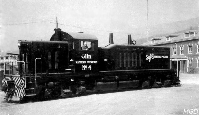 Saltville - Olin Engine No. 4
OLIN MATHIESON DIESEL NO. 4 WAS BROUGHT TO SALTVILLE FROM DETROIT IN 1960.  THE ENGINE HAD 12 CYLINDERS AND 1000 HP. WHEN OLIN CEASED OPERATIONS AT SALTVILLE IN 1972, IT WAS TRANSFERRED TO AN OLIN PLANT IN BEAUMONT, TEXAS.  MYRL DUNHAM PHOTO.  Courtesy of Don Smith [email]dsmith1043@comcast.net[/email]

