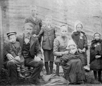 Click to view full size image
==============
Phipps, Emory Family
Phipps Family
This is a picture of the Emory Phipps family. Based on information I've researched, I believe the following to be true: Emory Phipps is seated with Thomas Phipps on his lap, his wife Ida Perry Phipps is holding Delmar Emory Phipps on her lap with daughters Elva Phipps Sage and Ora Phipps Hamby. One of the two standing boys is Roscoe Phipps and the other is unknown - not sure which is which. I believe this picture was taken in 1912 because Ida died in May 1912. Any information about the individuals in the picture would be greatly appreciated. Picture submitted by great granddaughter Lynn Sexton Gallegos Arbadella64@yahoo.com
Phipps, Emory Family
Phipps Family
This is a picture of the Emory Phipps family. Based on information I've researched, I believe the following to be true: Emory Phipps is seated with Thomas Phipps on his lap, his wife Ida Perry Phipps is holding Delmar Emory Phipps on her lap with daughters Elva Phipps Sage and Ora Phipps Hamby. One of the two standing boys is Roscoe Phipps and the other is unknown - not sure which is which. I believe this picture was taken in 1912 because Ida died in May 1912. Any information about the individuals in the picture would be greatly appreciated. Picture submitted by great granddaughter Lynn Sexton Gallegos Arbadella64@yahoo.com