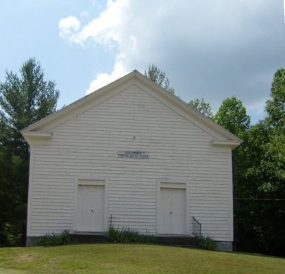 Saddle Creek - Saddle Creek Primitive Baptist Church
Established in1842, Saddle Creek Primitive Baptist Meeting-house is one of the most recognizable landmarks west of Independence, as it is located on the southside of U.S.58 the main east-west thoroughfare through Grayson County.  This style of meeting house with the dual front doors was popular in the late 19th century.  Men would enter on one side and women on the other.  Photo June 8, 2007 by Jeff Weaver
