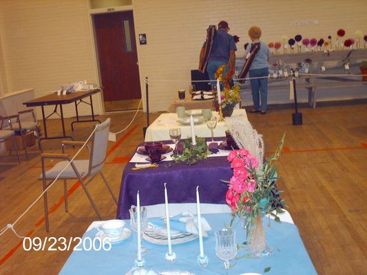 pics 117.jpg
This shot shows some of the judged table arrangements.  The table with the purple cloth won first place, entered by Katherine Beattie.  Photo September 23, 2006 by Jeff Weaver.
