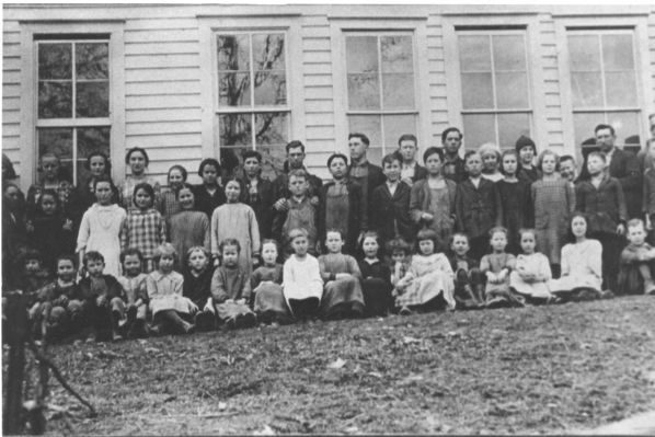 wolfknobschool20a.jpg
This is a school photograph made at the Wolf Knob School in the early 1920s.  Wolf Knob School, Rugby, Grayson County, Virginia, ca. 1920

Left to right, 1st row: Boy behind tree unknown, Raymond Owen, Monty Greer, Severt Spencer, May Perry, Clyde Kilby, Mary Edith Farmer, Jincy Duvall, Grace Kilby, Blanche Owen, Gaither Testerman, Mazie Farmer, Wave Farmer, Vincy Spencer, Woodrow Kilby.
2nd Row: Blair Kilby, Guida Sturgill, Vilena Weaver, Gay Reedy, Mamie Greer, Cora Greer, Ralph Spencer, Walter Perry, Chester Testerman, Gaither Farmer, Cora Sturgill, Maggie Owen, Cleve Farmer, Charlie Duvall, Dean Kilby, Mae Sebastian (Teacher), Ruth Kilby, Charity Kilby, Maryann Spencer, Sybil Owen, Fanny Kilby, Cody Owen, Ora Kilby, Garman Spencer, Arthur Farmer, Otis Kilby, Nancy Jane Farmer, Ersadell Sturgill, Gaither Kilby (Teacher), Guy Kilby.



