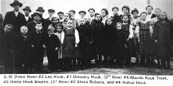 houk15.jpg
Left to right, front row.  #2 Martha Roberts Hackler, #3 Callia Donia Roberts Houk, #4 Mary Robert Catron. #7 Len G. Houk, #9, Alma G. Trent Houk.  Courtesy of Thom Houk.
