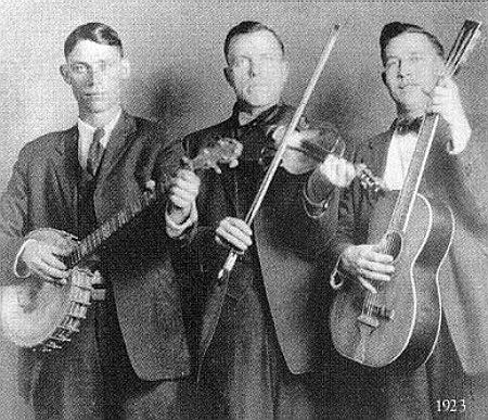 Poole. Charlie and the North Carolina Ramblers
Charlie Poole, with the fiddle, is shown here in a late 1920 image with the North Carolina Ramblers.

