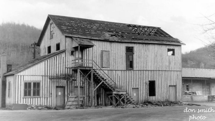 salthouse1.jpg
A CLOSER LOOK AT THE OLD SALT HOUSE BUILDING.

OLD SALT HOUSE BUILT ON THE SITE OF THE GEORGIA SALT FURNACE.  THE SALT HOUSE WAS USED FOR STORING SACKS AND BARRELS.  AFTER IT WAS NO LONGER USED FOR THAT THE TOP FLOOR BECAME THE MEETING PLACE FOR WILLIAM KING MASONIC LODGE NO. 227 OF SALTVILLE FROM 1901 UNTIL A NEW MEETING HALL WAS BUILT IN DOWNTOWN IN 1949.
 
THE BOTTOM FLOOR WAS USED BY MATHIESON CHEMICALS.
 
IN MARCH OF 1965...SHORTLY AFTER THIS PICTURE WAS MADE, THE OLD SALT HOUSE WAS TORN DOWN.  IT WAS LOCATED ON WEST MAIN STREET IN SALTVILLE, VIRGINIA.  Courtesy of Don Smith [email]dsmith1043@comcast.net[/email]
