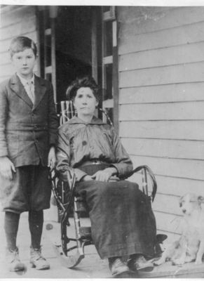 West, Theodosia
This photo shows Theodosia Blevins West (daughter of Dr. David Blevins and Nancy Jacks/wife of Rush Floyd West) with her son George and unknown dog.  This photo dates from circa 1915, and was taken at their home at Grassy Creek.  From Jeff Weaver's collection.
